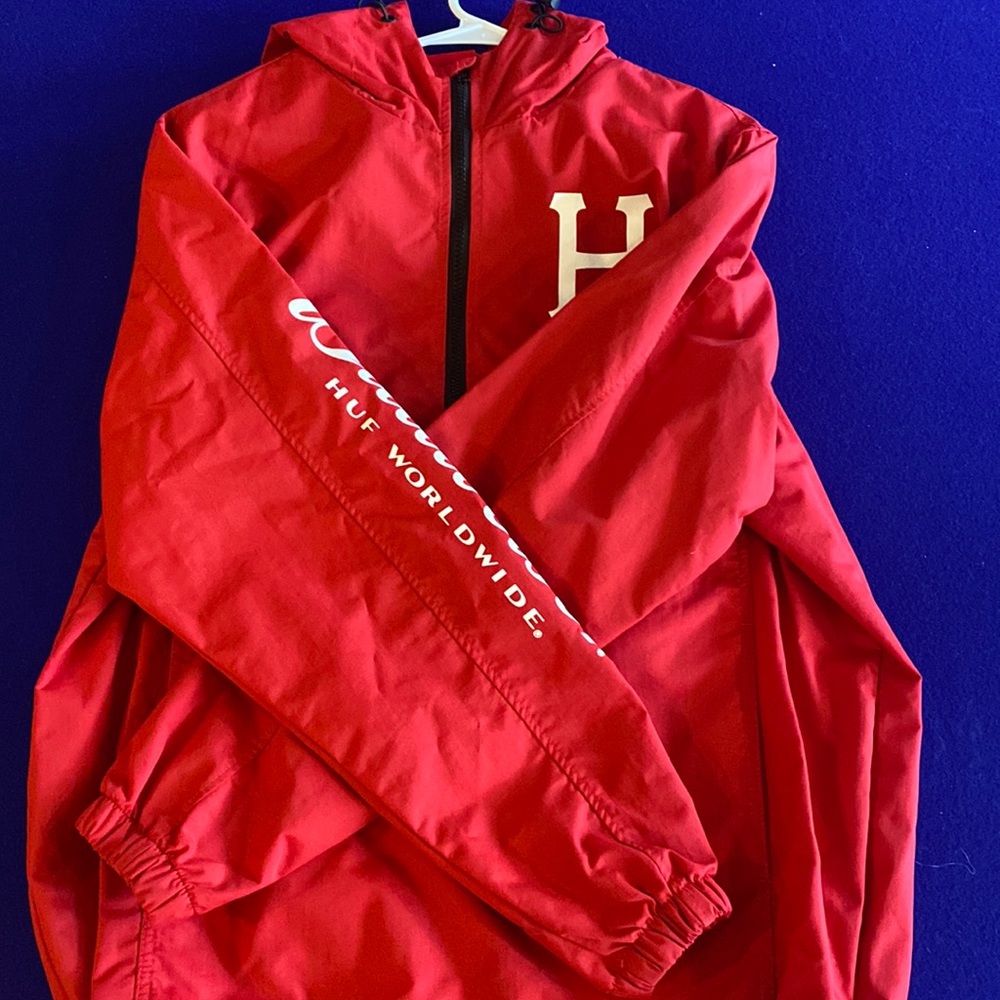 HUF “Budweiser” windbreaker. Red, slightly worn Good Condition.